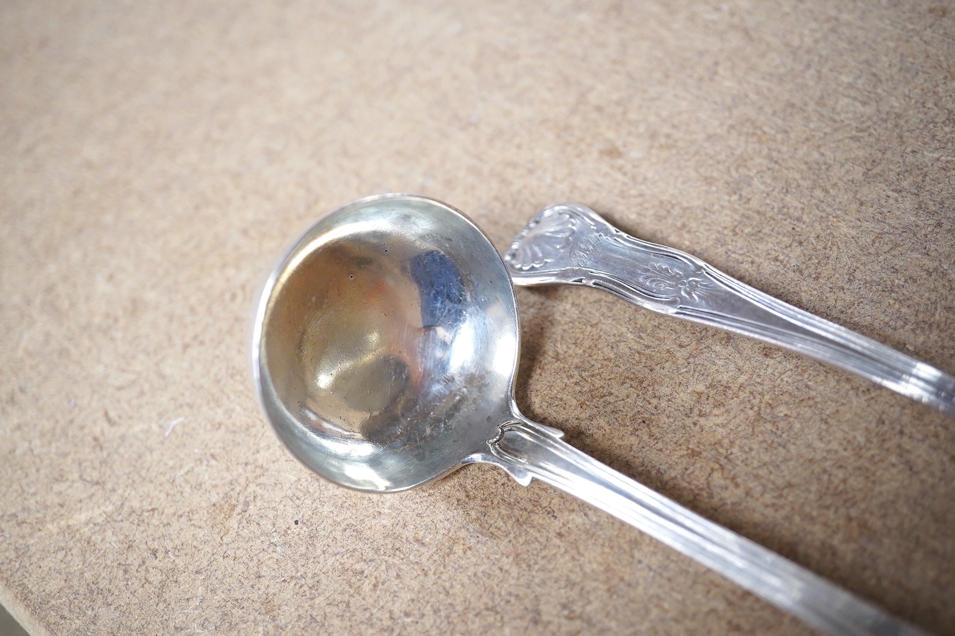 A pair of William IV Scottish silver King's pattern toddy ladles, James & William Marshall, Edinburgh, 1830, 14.2cm, 71 grams. Condition - poor to fair